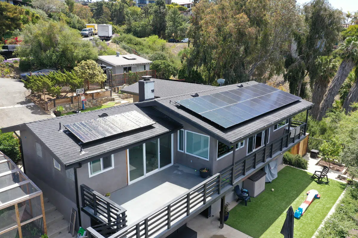 Aerial view of a home with rooftop solar panels